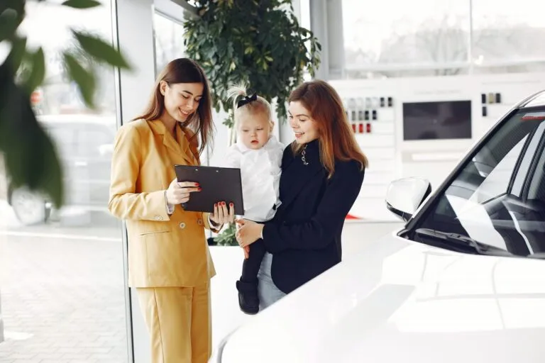 smiling-mother-choosing-new-car